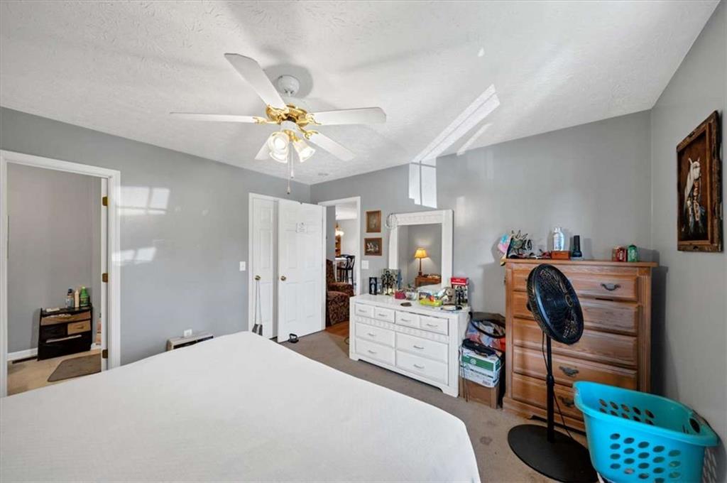 221 Pleasant Way Temple, GA 30179 - Photo 23 of 35 a bedroom with furniture and a chandelier