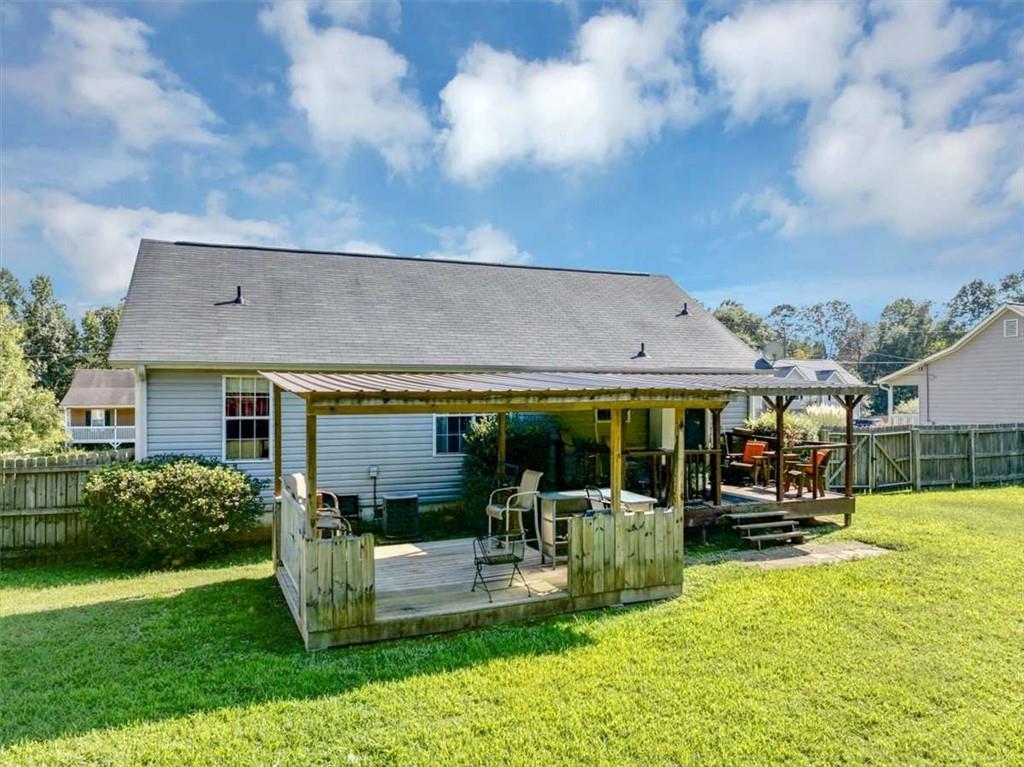 221 Pleasant Way Temple, GA 30179 - Photo 28 of 35 a front view of a house with a yard table and chairs