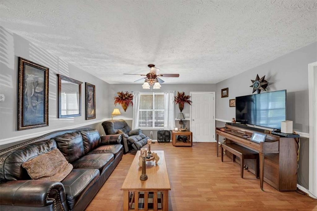 221 Pleasant Way Temple, GA 30179 - Photo 5 of 35 a living room with furniture and a flat screen tv