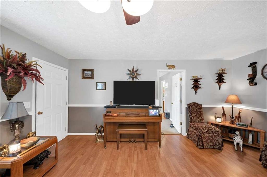 221 Pleasant Way Temple, GA 30179 - Photo 6 of 35 a living room with furniture and a flat screen tv