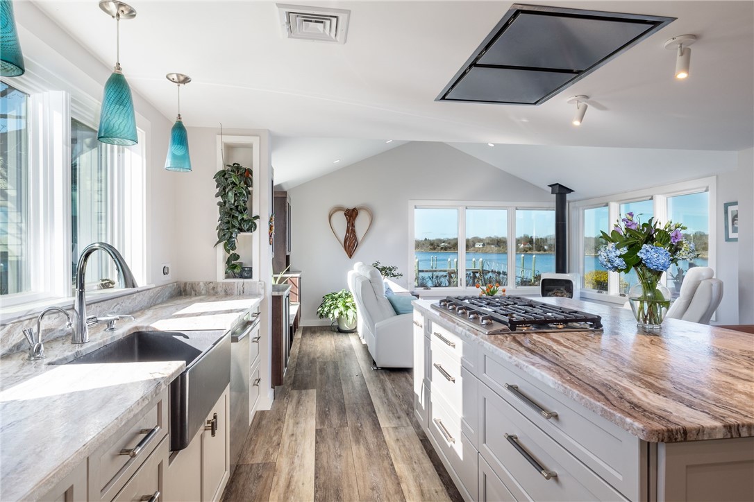 25 Barnacle Road Narragansett, RI 02882 - Photo 5 of 32 Open kitchen and living area abounding with windows and light