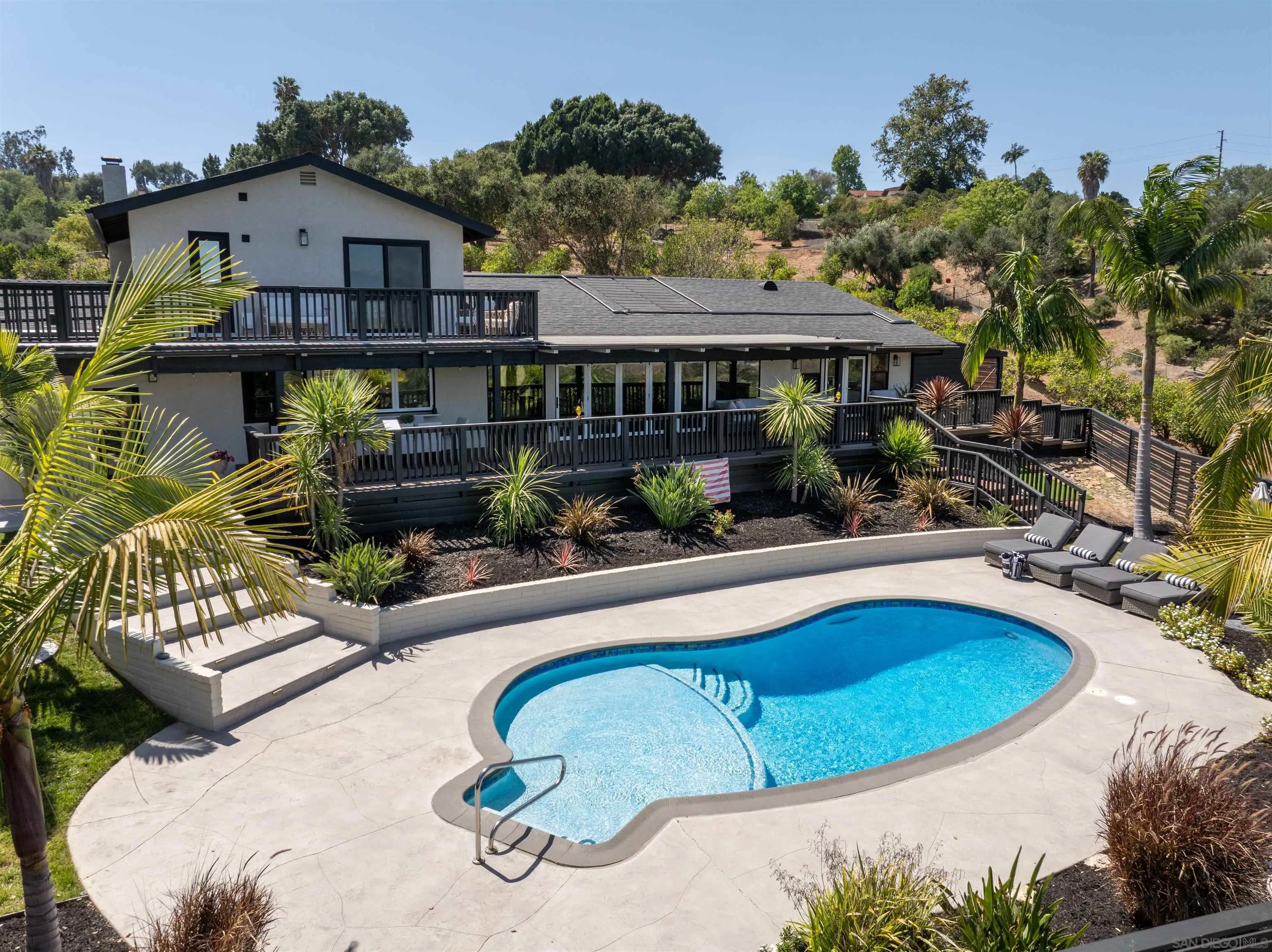 521 Rancho Camino Fallbrook, CA 92028 - Photo 55 of 72 a view of swimming pool with outdoor seating and plants