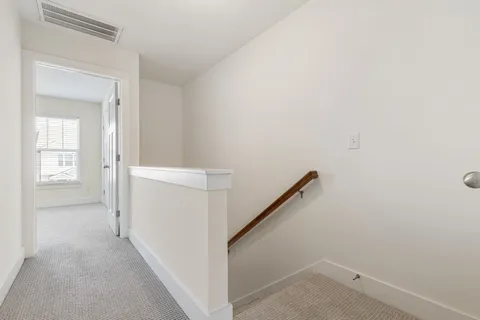a view of a hallway with closet
