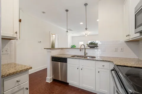 a kitchen with a sink and cabinets