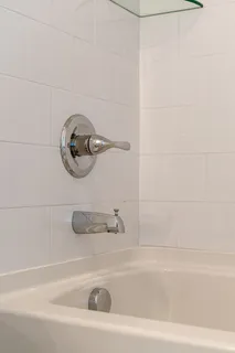 a view of a patio with couches chairs and wooden floor
