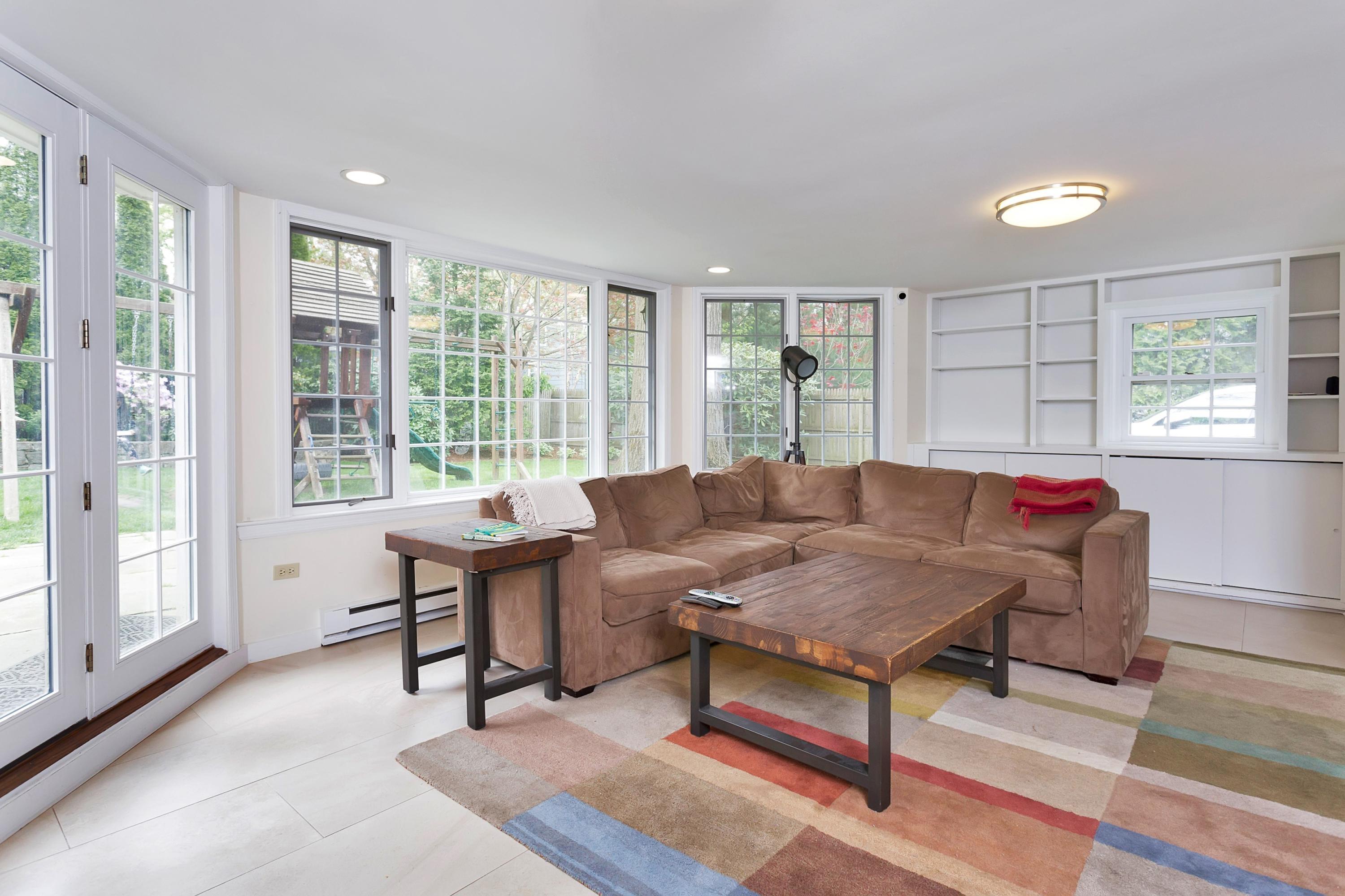 25 Bramble Lane Riverside, CT 06878 - Photo 5 of 10 a living room with furniture and a large window