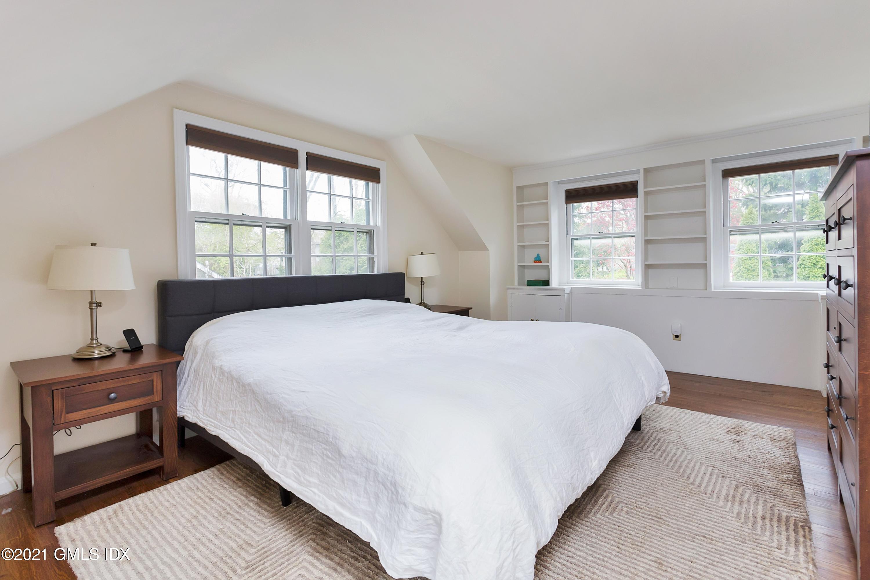 25 Bramble Lane Riverside, CT 06878 - Photo 6 of 10 a bedroom with a bed and a window