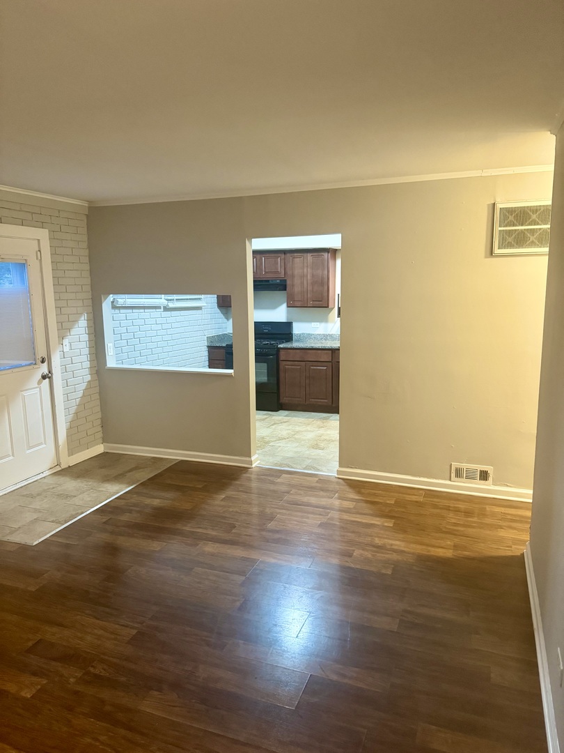 245 Allegheny Street Park Forest, IL 60466 - Photo 2 of 19 a view of empty room with wooden floor