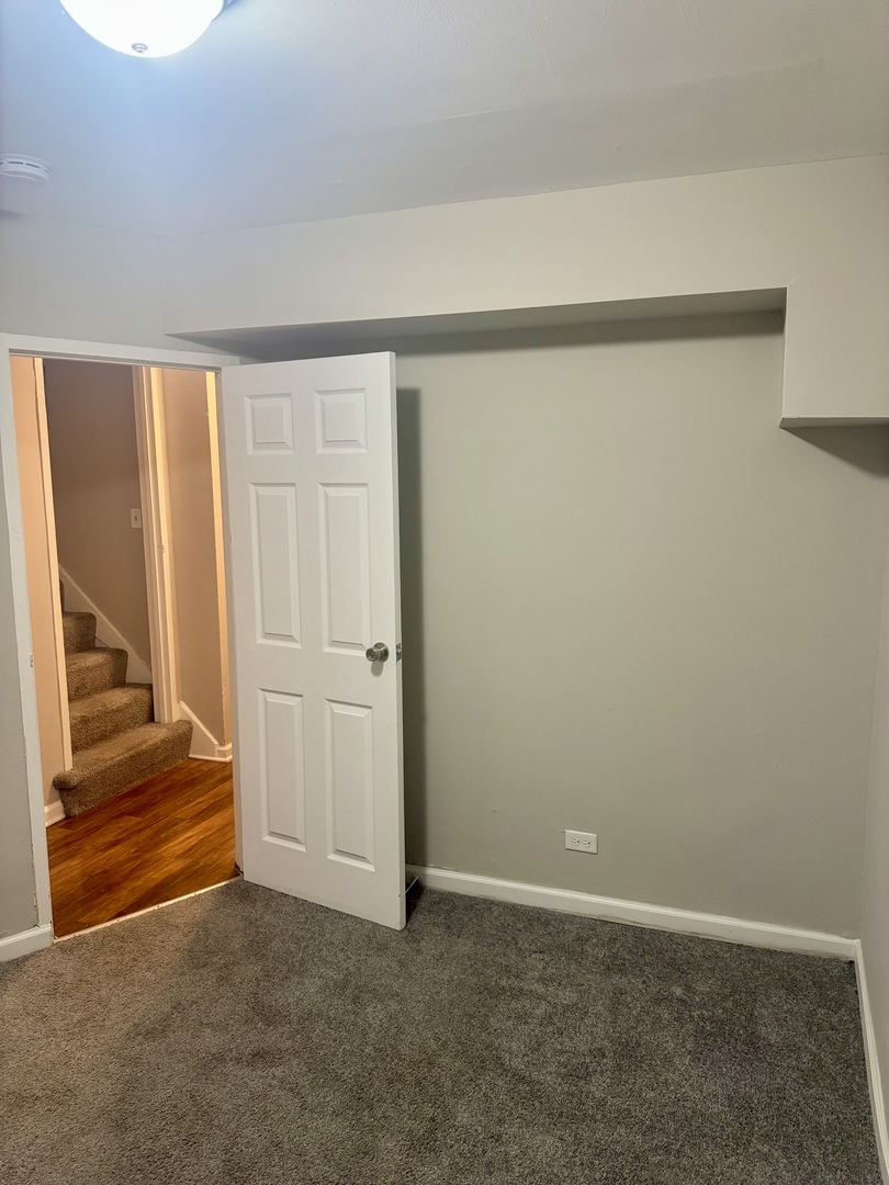 245 Allegheny Street Park Forest, IL 60466 - Photo 6 of 19 an empty room with a bench