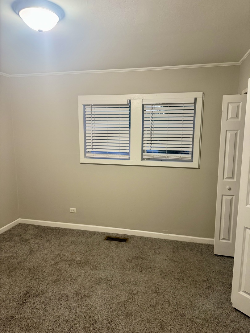 245 Allegheny Street Park Forest, IL 60466 - Photo 7 of 19 an empty room with a window