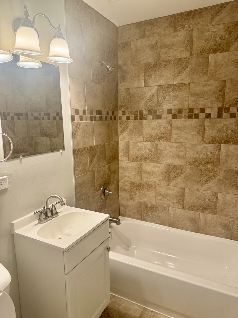 245 Allegheny Street Park Forest, IL 60466 - Photo 9 of 19 a bathroom with a sink and a bathtub