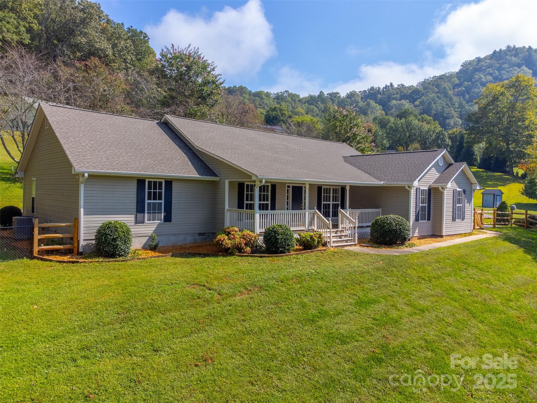 1061 Calvary Church Road Sylva, NC 28779 - Photo 1 of 46 a front view of a house with yard porch and green space
