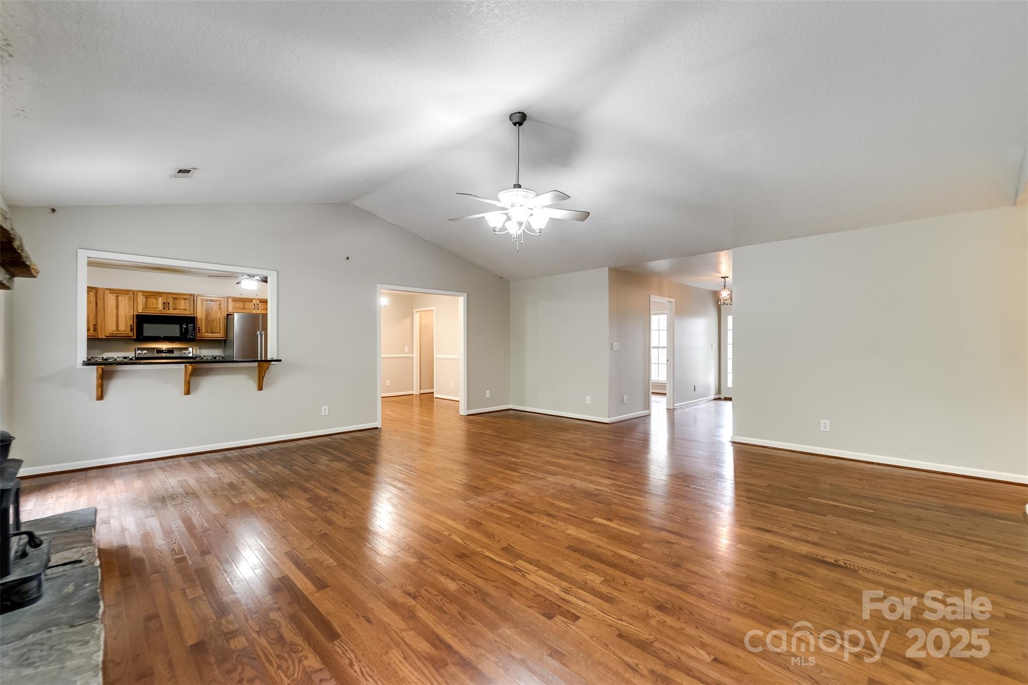 1061 Calvary Church Road Sylva, NC 28779 - Photo 11 of 46 a view of a livingroom with wooden floor and a flat screen tv