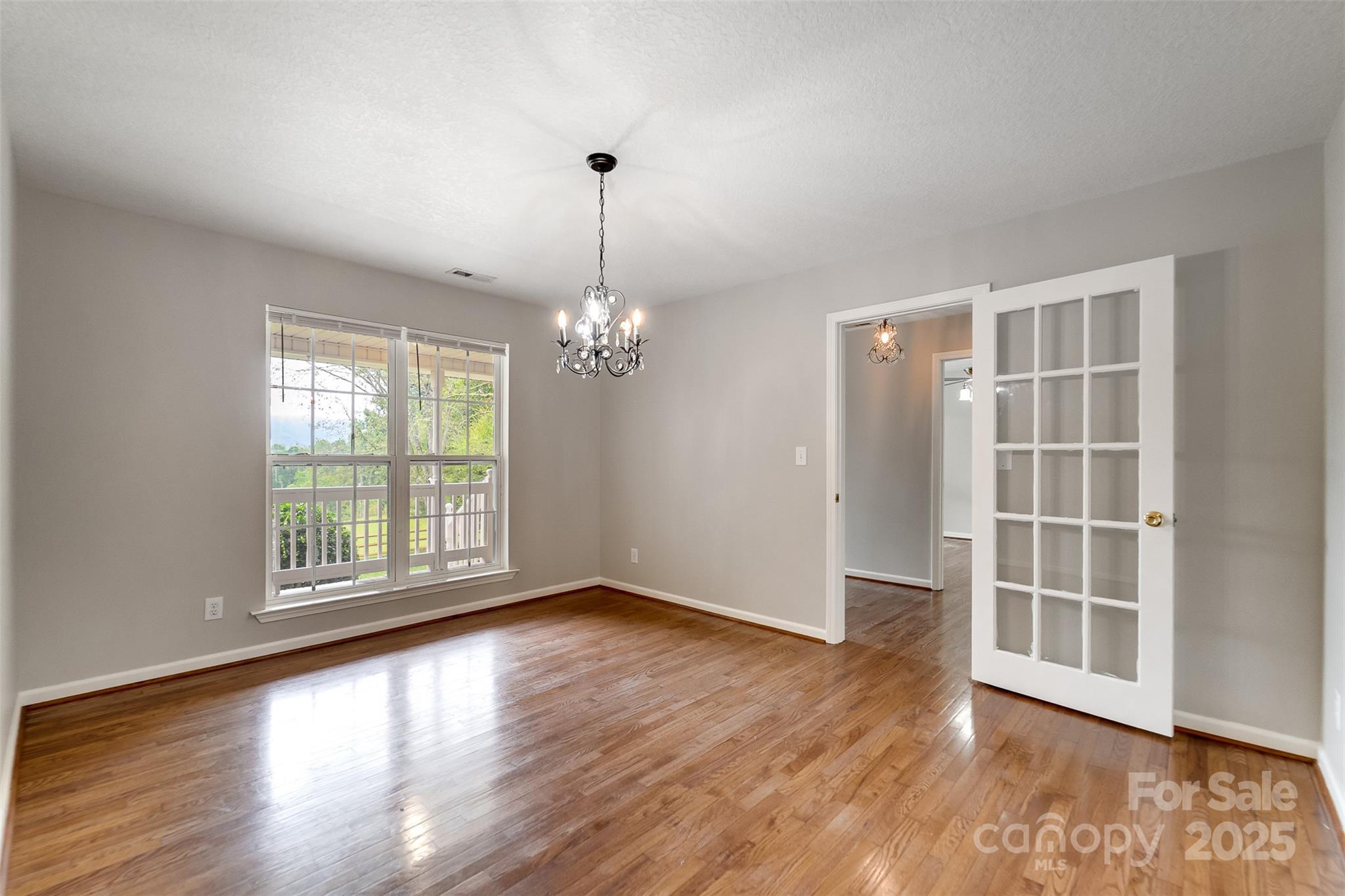 1061 Calvary Church Road Sylva, NC 28779 - Photo 13 of 46 a view of empty room with wooden floor and fan