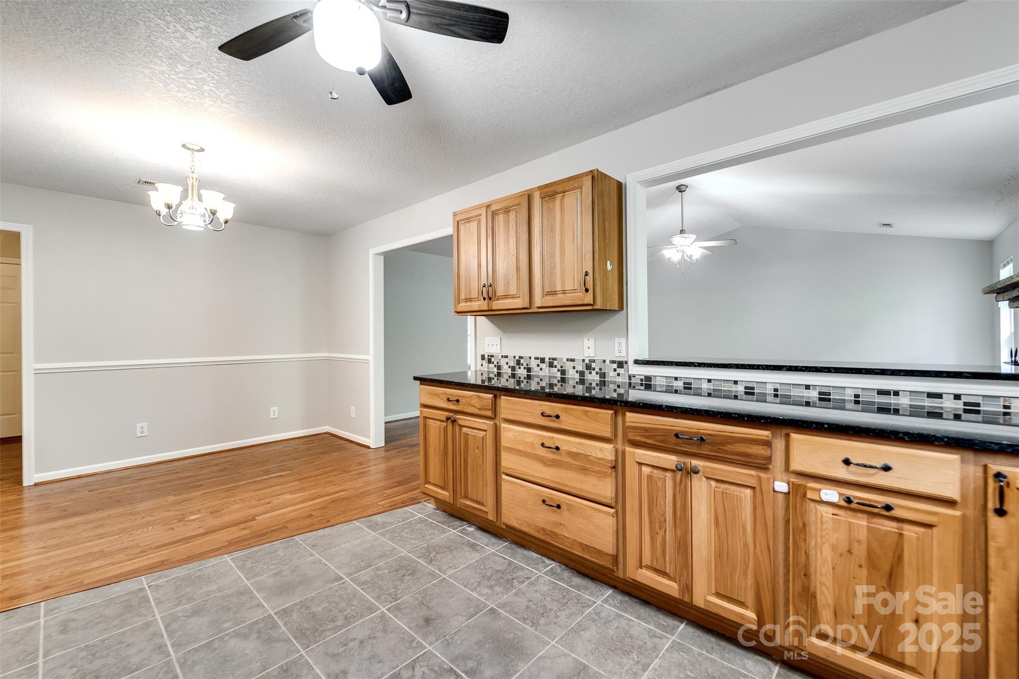 1061 Calvary Church Road Sylva, NC 28779 - Photo 15 of 46 a view of a kitchen with a sink and chandelier