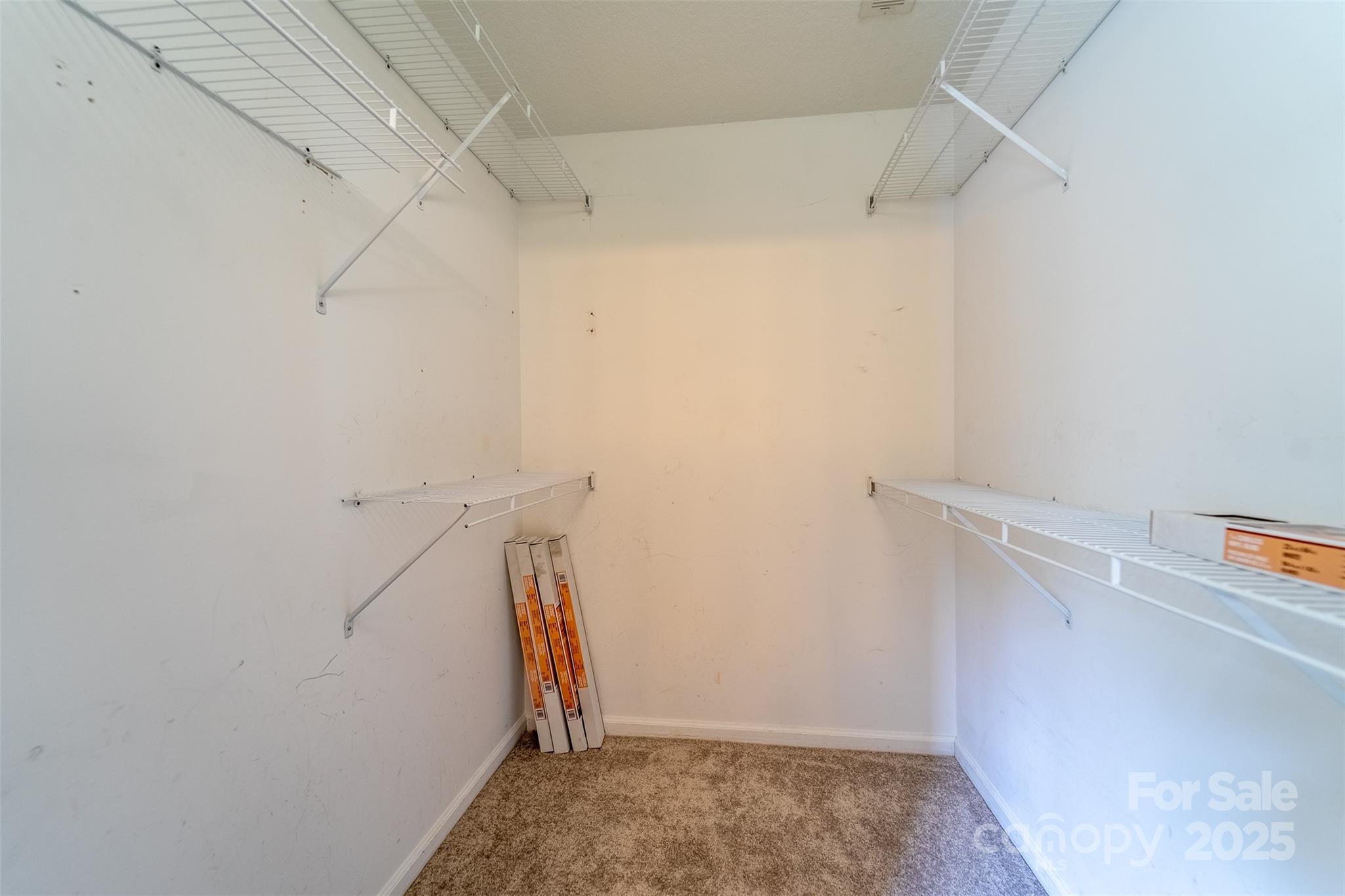 1061 Calvary Church Road Sylva, NC 28779 - Photo 20 of 46 a view of walk in closet with empty racks