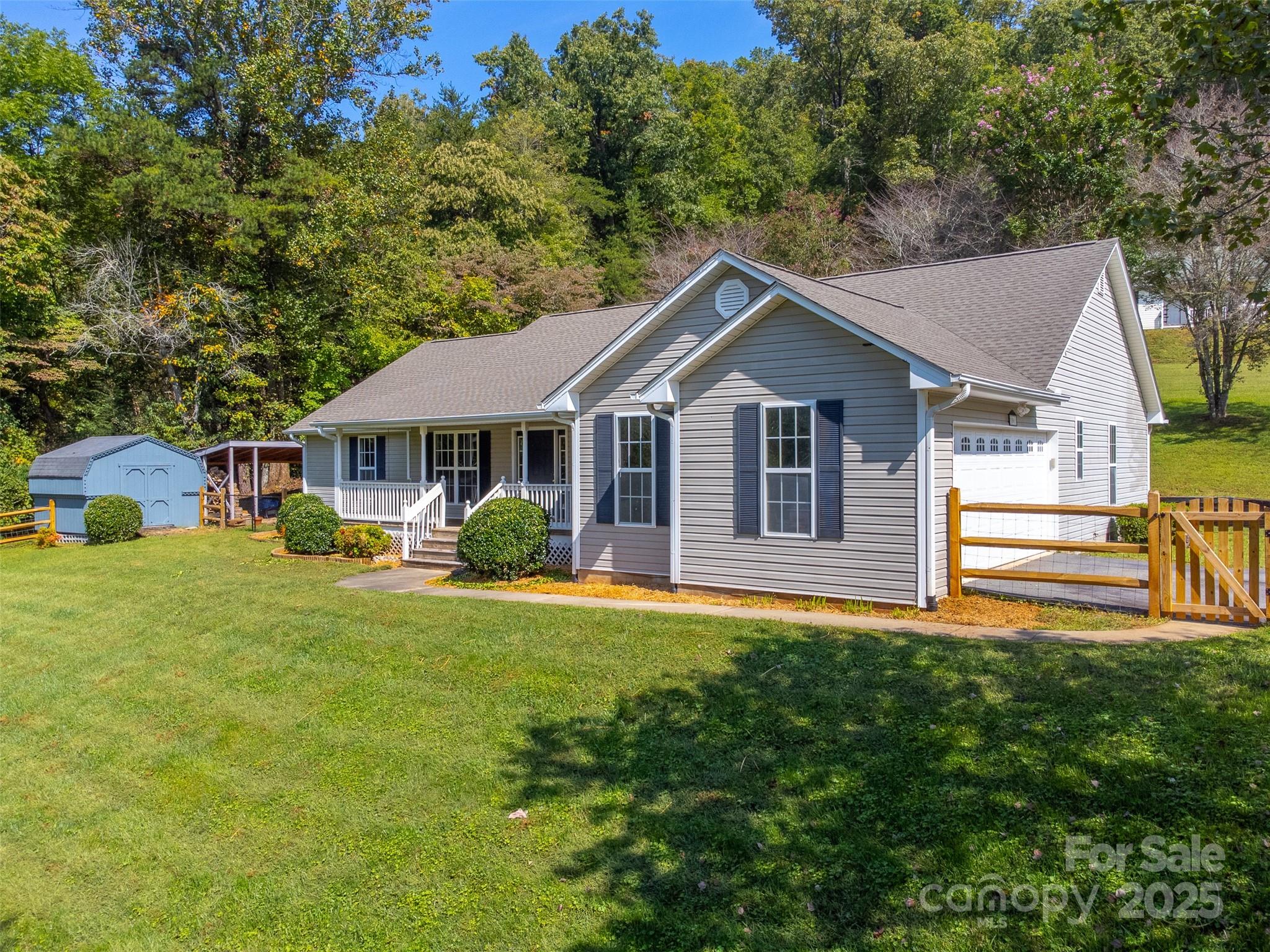 1061 Calvary Church Road Sylva, NC 28779 - Photo 2 of 46 a front view of a house with a yard
