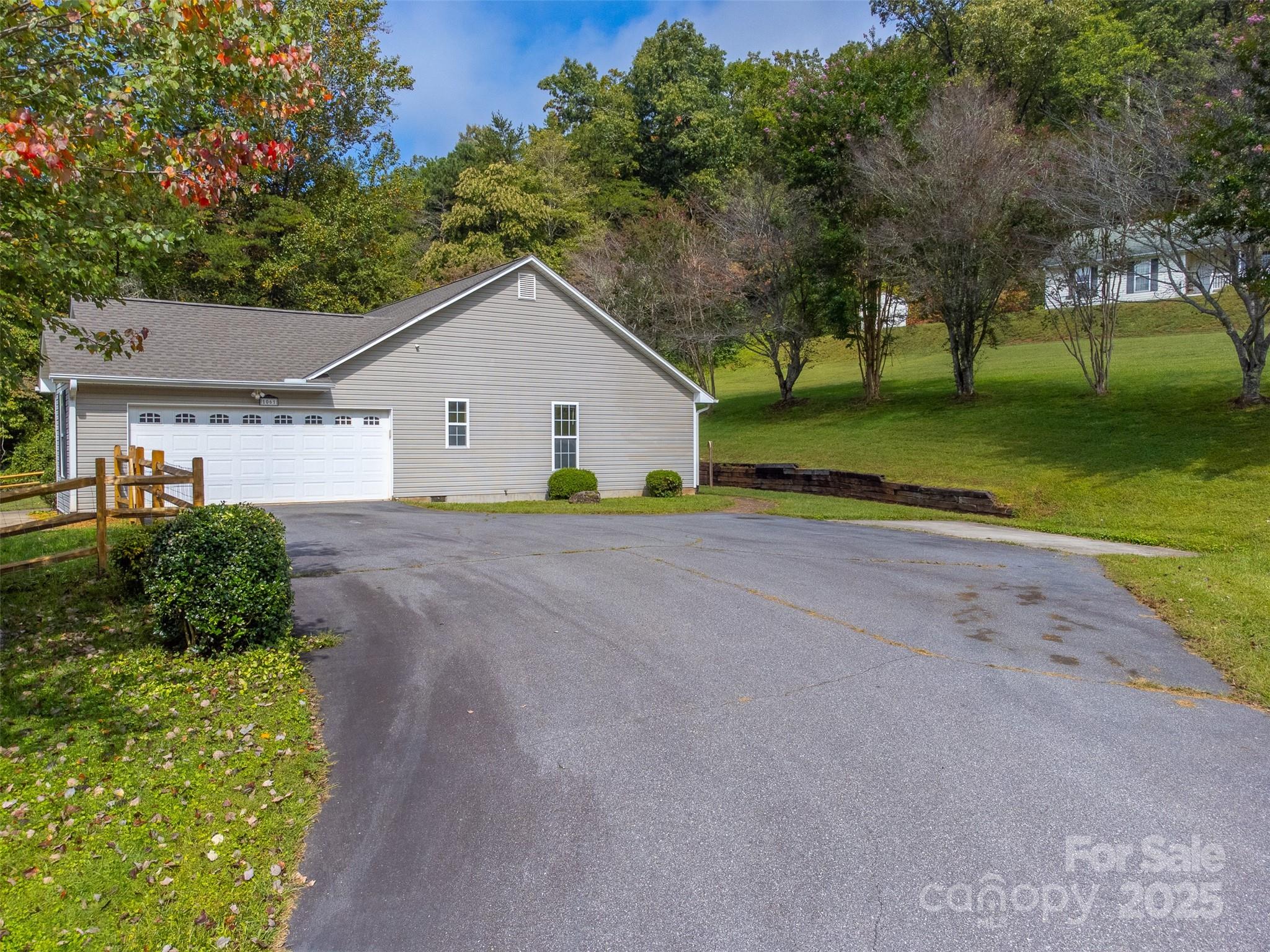 1061 Calvary Church Road Sylva, NC 28779 - Photo 26 of 46 a view of a house with a big yard plants and large trees