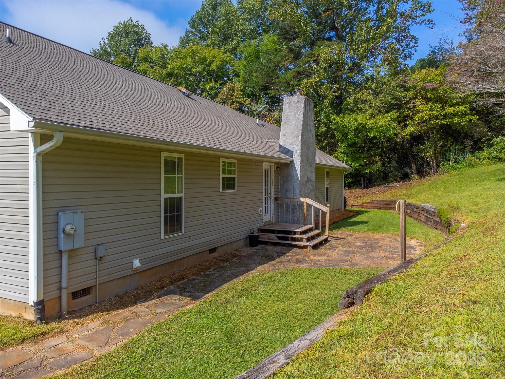 1061 Calvary Church Road Sylva, NC 28779 - Photo 29 of 46 a view of a backyard with a small cabin