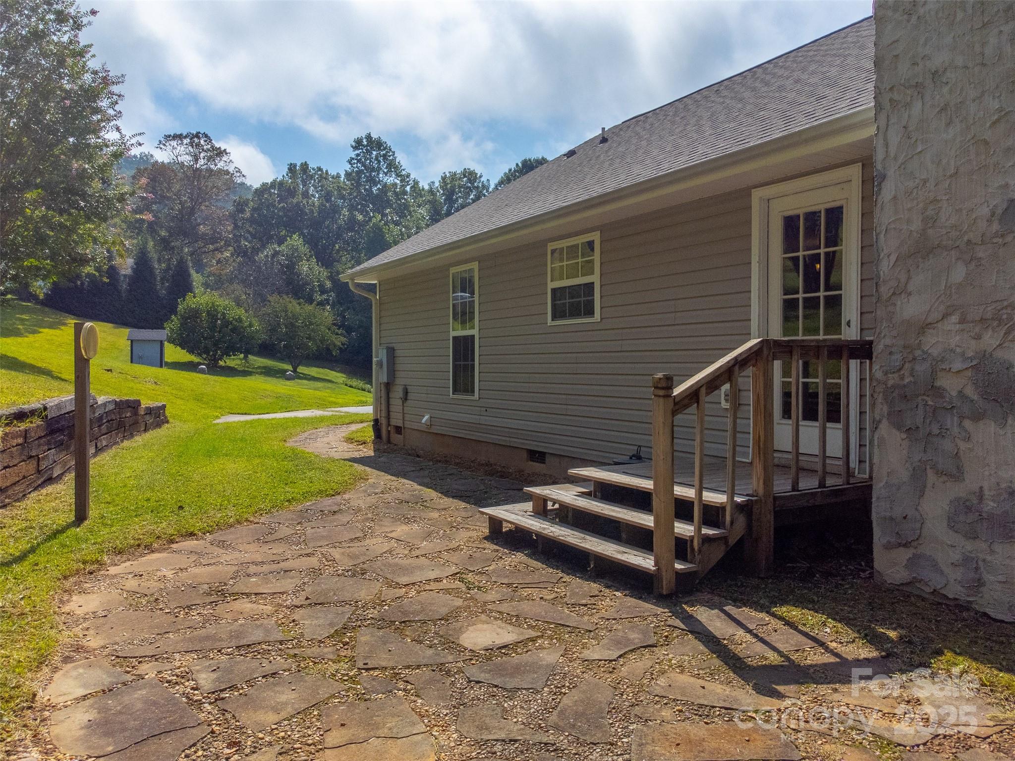 1061 Calvary Church Road Sylva, NC 28779 - Photo 31 of 46 a view of a backyard with a small cabin