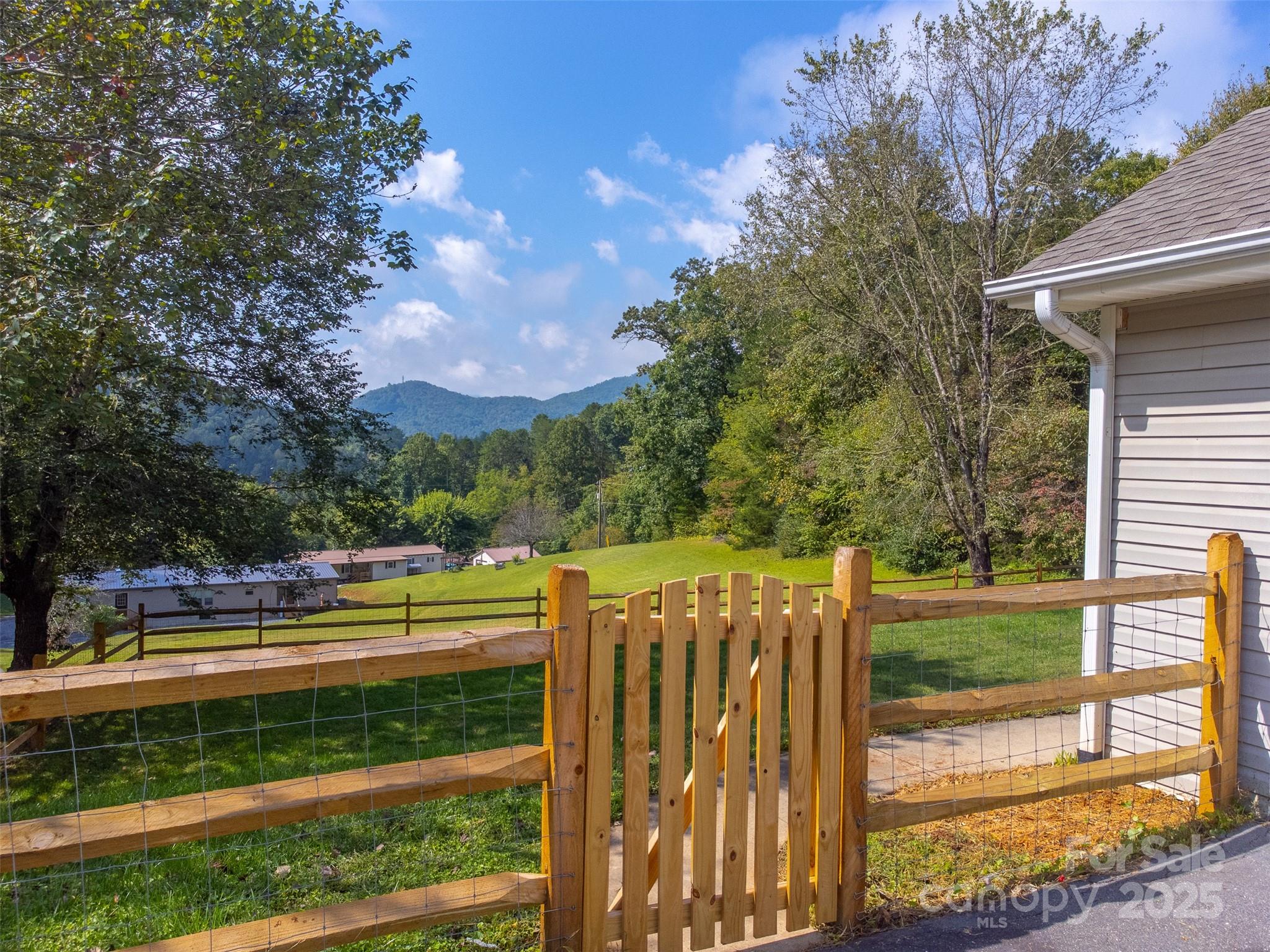 1061 Calvary Church Road Sylva, NC 28779 - Photo 34 of 46 a view of a yard with wooden fence