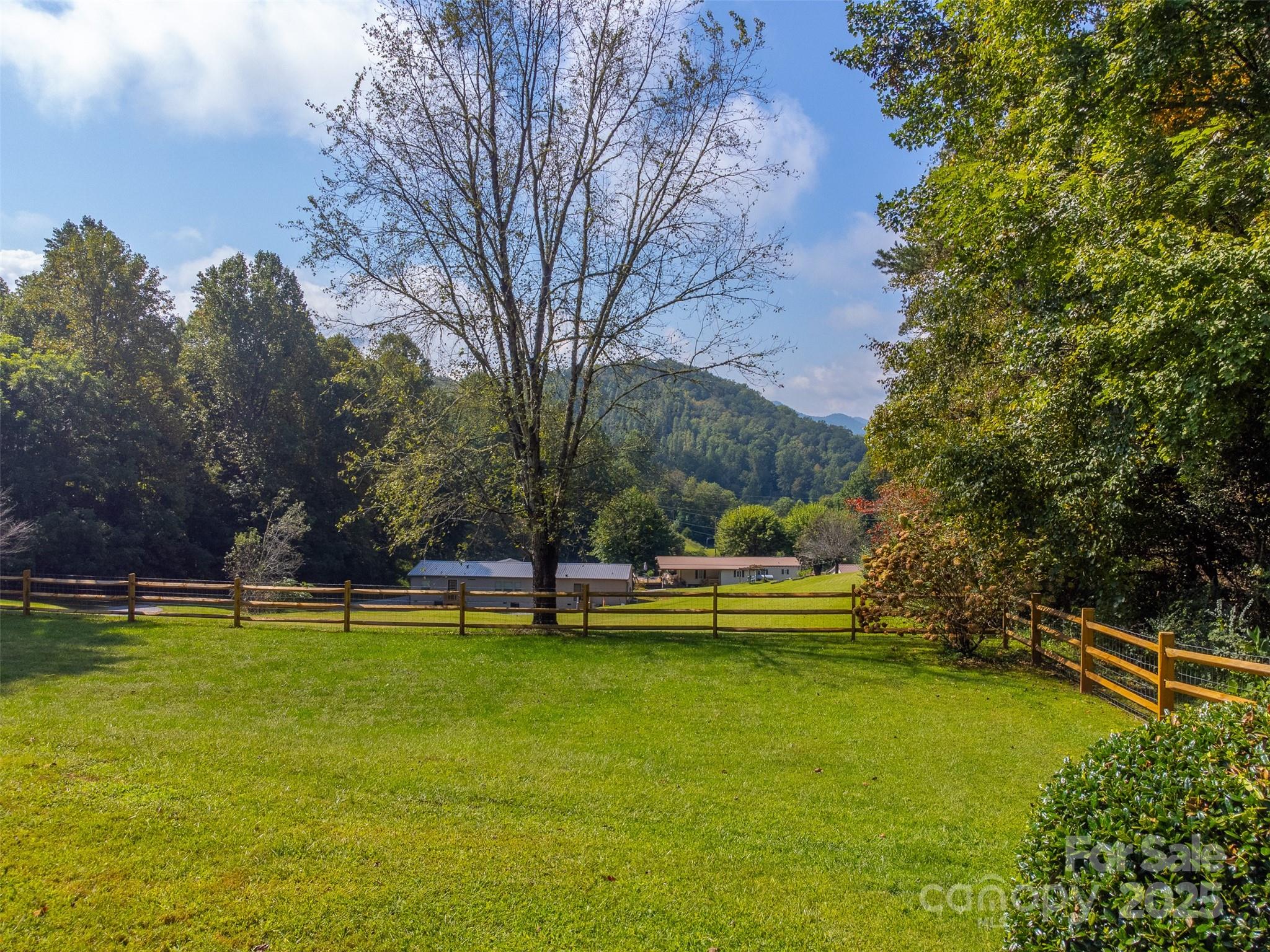 1061 Calvary Church Road Sylva, NC 28779 - Photo 37 of 46 a view of a swimming pool with an outdoor seating and a yard