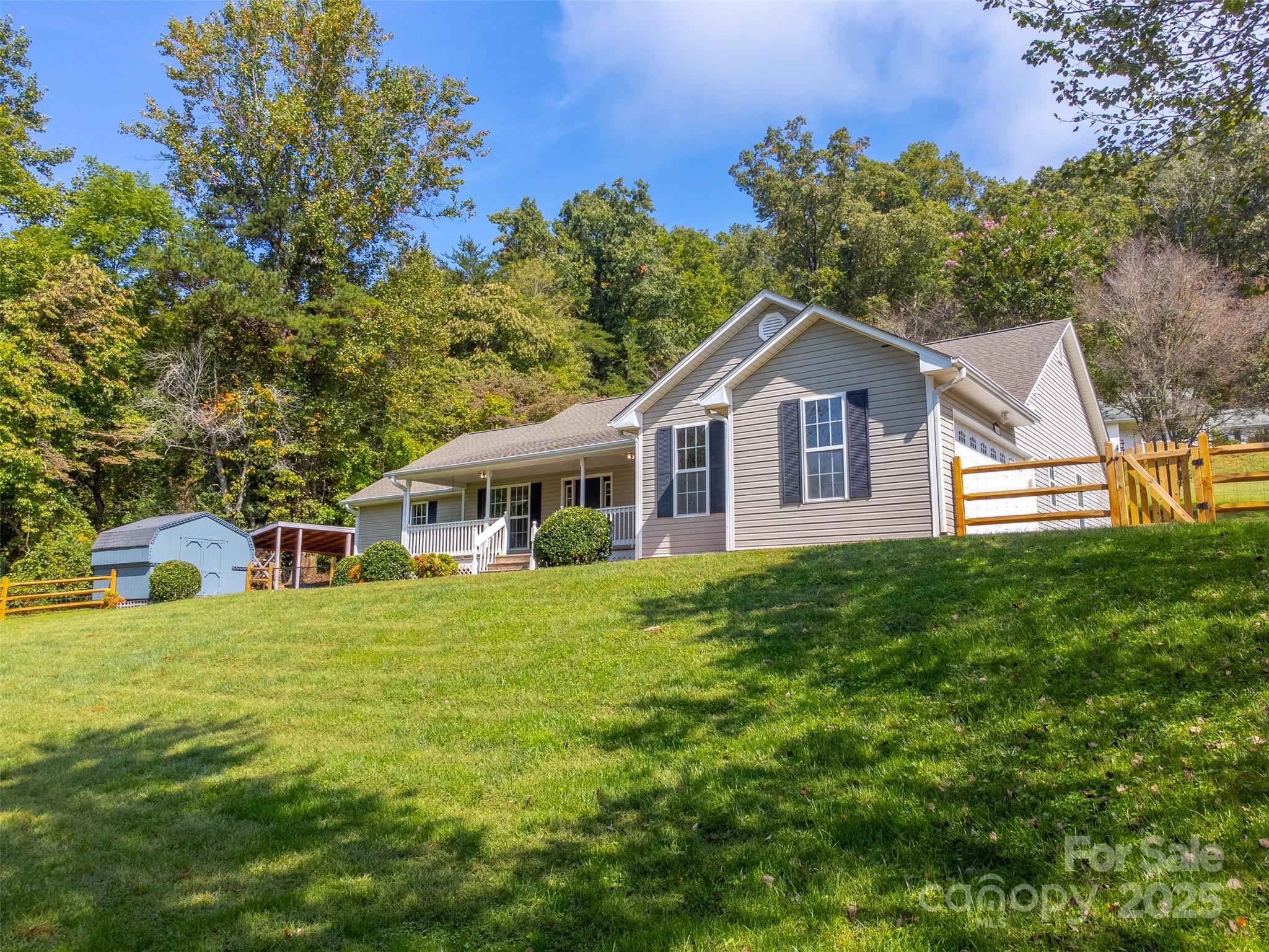 1061 Calvary Church Road Sylva, NC 28779 - Photo 41 of 46 a front view of a house with a garden