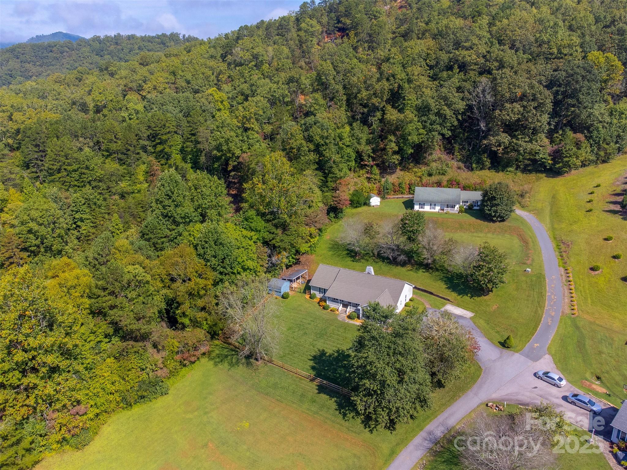 1061 Calvary Church Road Sylva, NC 28779 - Photo 46 of 46 an aerial view of a house with a yard