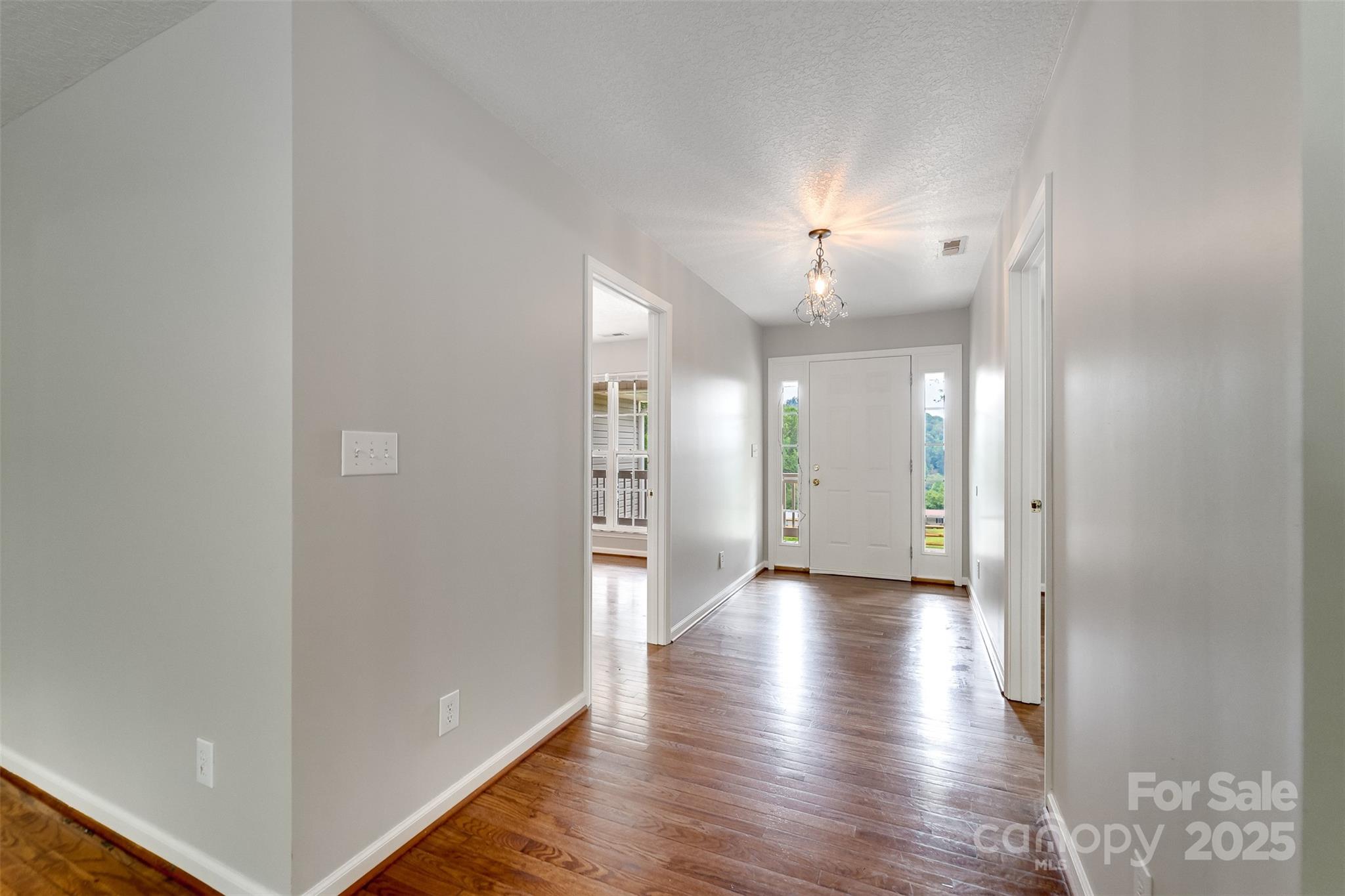 1061 Calvary Church Road Sylva, NC 28779 - Photo 9 of 46 a view of a hallway with wooden floor