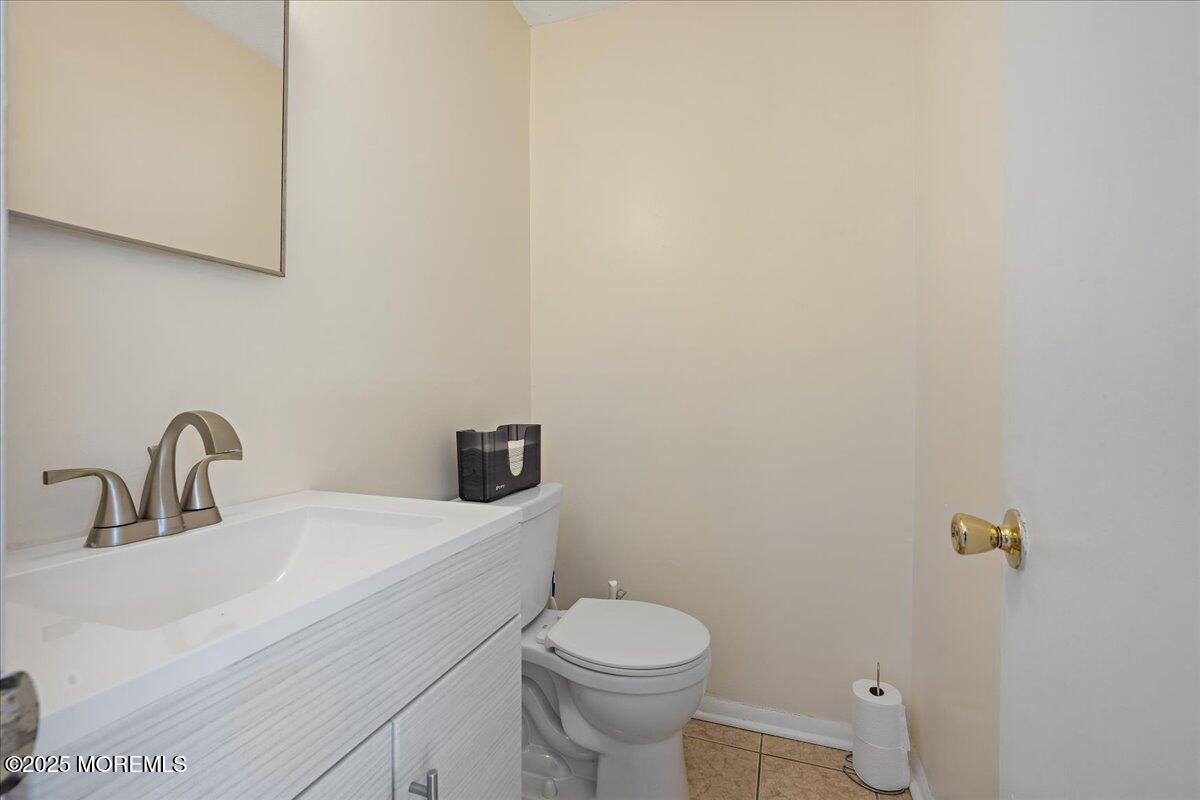 550 Labanna Court Brick, NJ 08724 - Photo 12 of 38 a bathroom with a sink a toilet and mirror