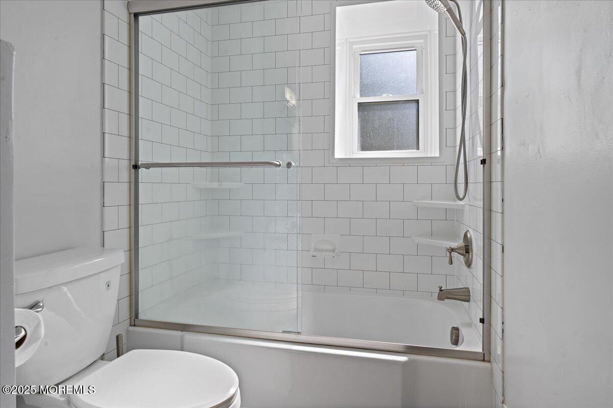550 Labanna Court Brick, NJ 08724 - Photo 17 of 38 a bathroom with a toilet and shower