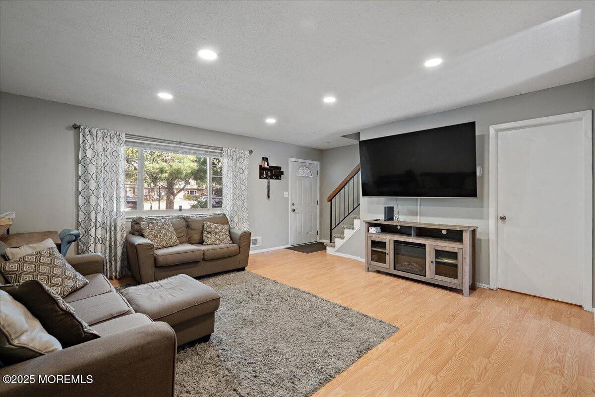 550 Labanna Court Brick, NJ 08724 - Photo 6 of 38 a living room with furniture and a flat screen tv