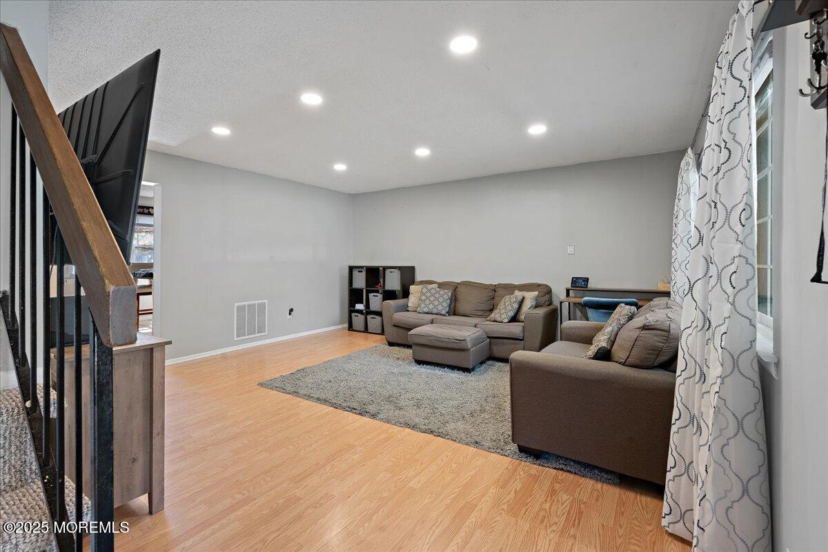 550 Labanna Court Brick, NJ 08724 - Photo 7 of 38 a living room with furniture and a flat screen tv