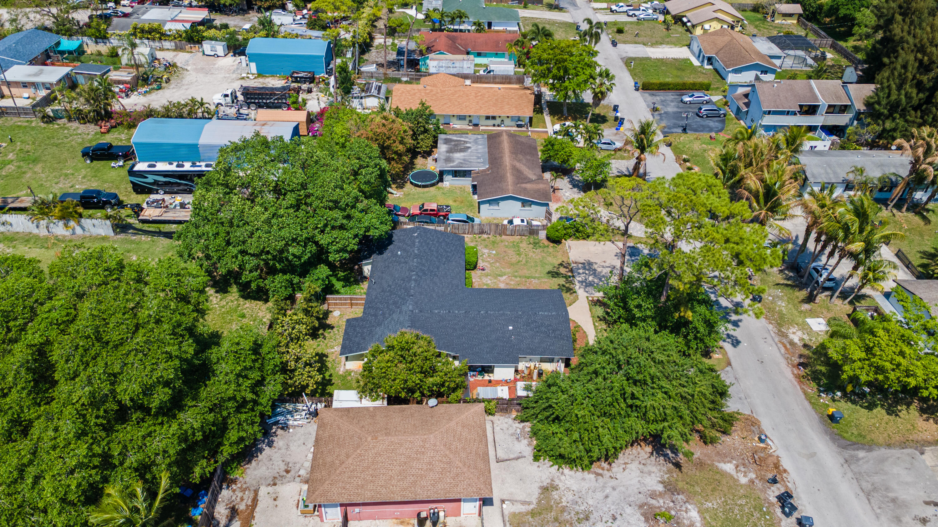 4453 Stevens Road Lake Worth Beach, FL 33461 - Photo 9 of 67 an aerial view of multiple houses with yard