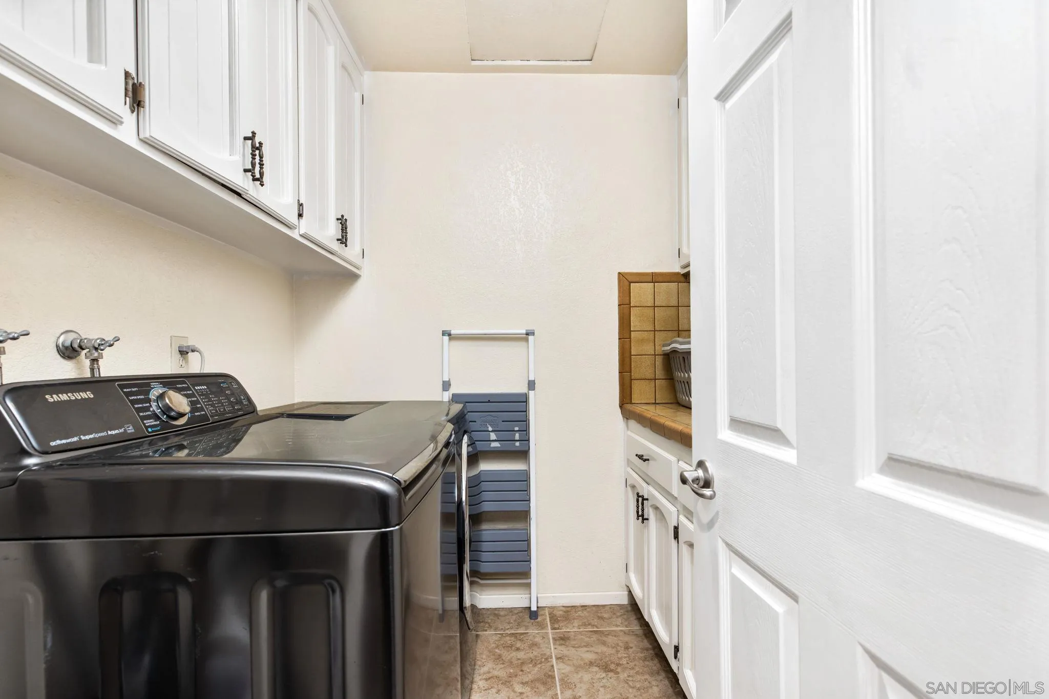 16614 Wikiup Road Ramona, CA 92065 - Photo 16 of 37 a utility room with dryer and washer