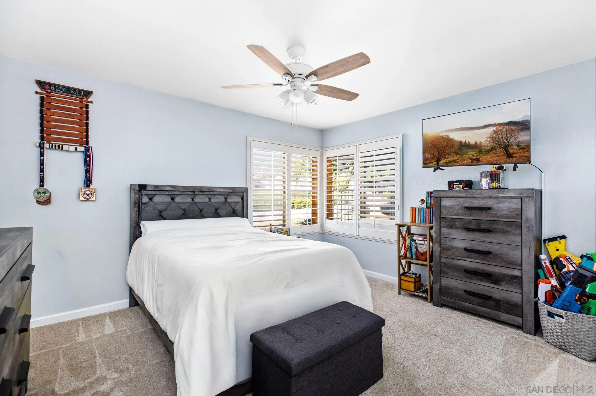 16614 Wikiup Road Ramona, CA 92065 - Photo 21 of 37 a bedroom with a bed and ceiling fan