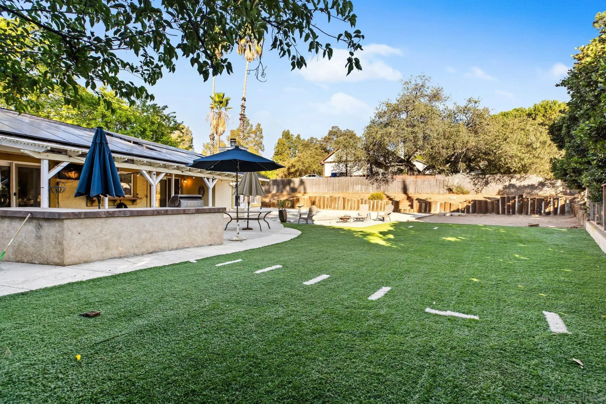 16614 Wikiup Road Ramona, CA 92065 - Photo 26 of 37 a view of a house with a big yard potted plants and large tree