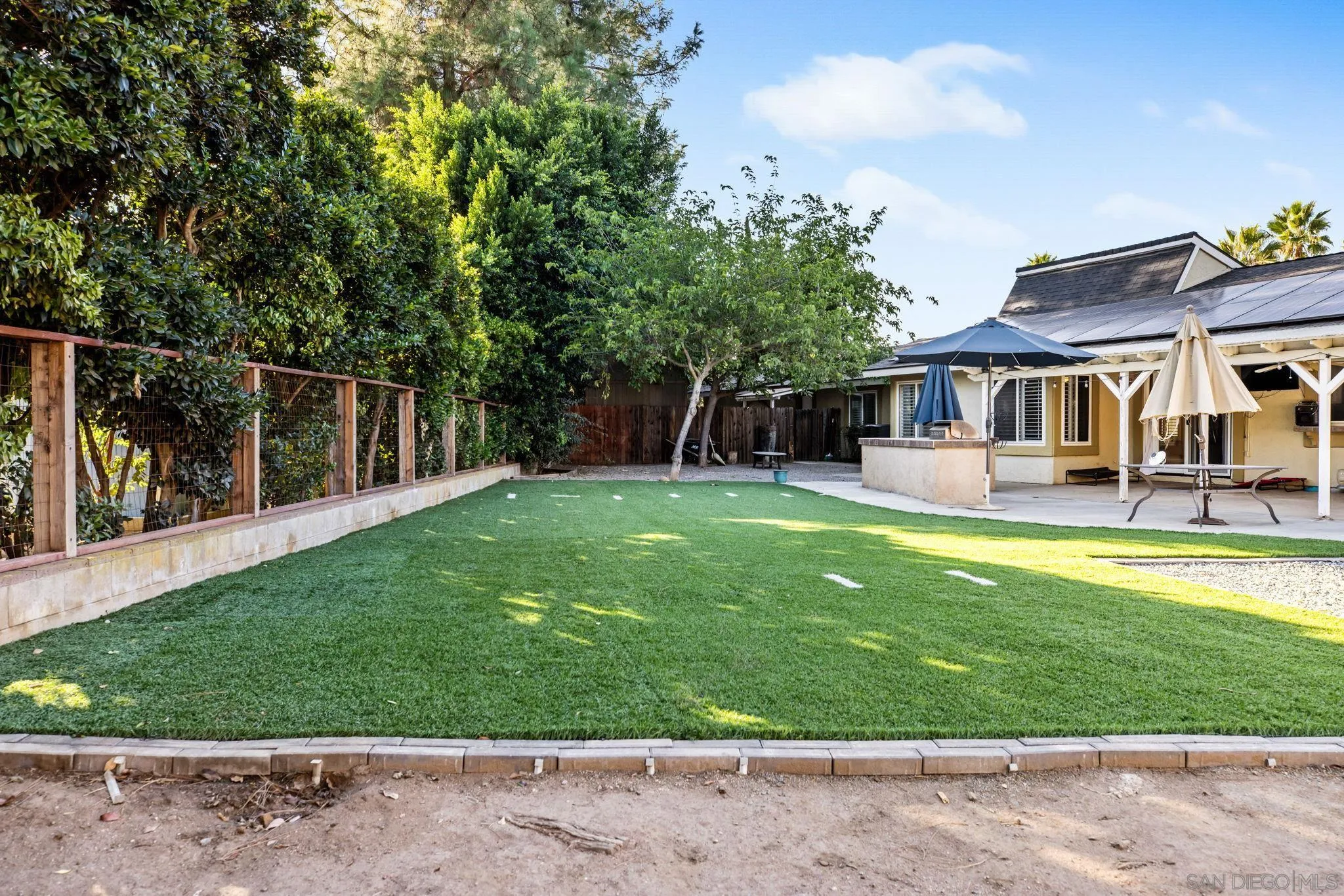 16614 Wikiup Road Ramona, CA 92065 - Photo 27 of 37 a view of a house with a backyard porch and sitting area