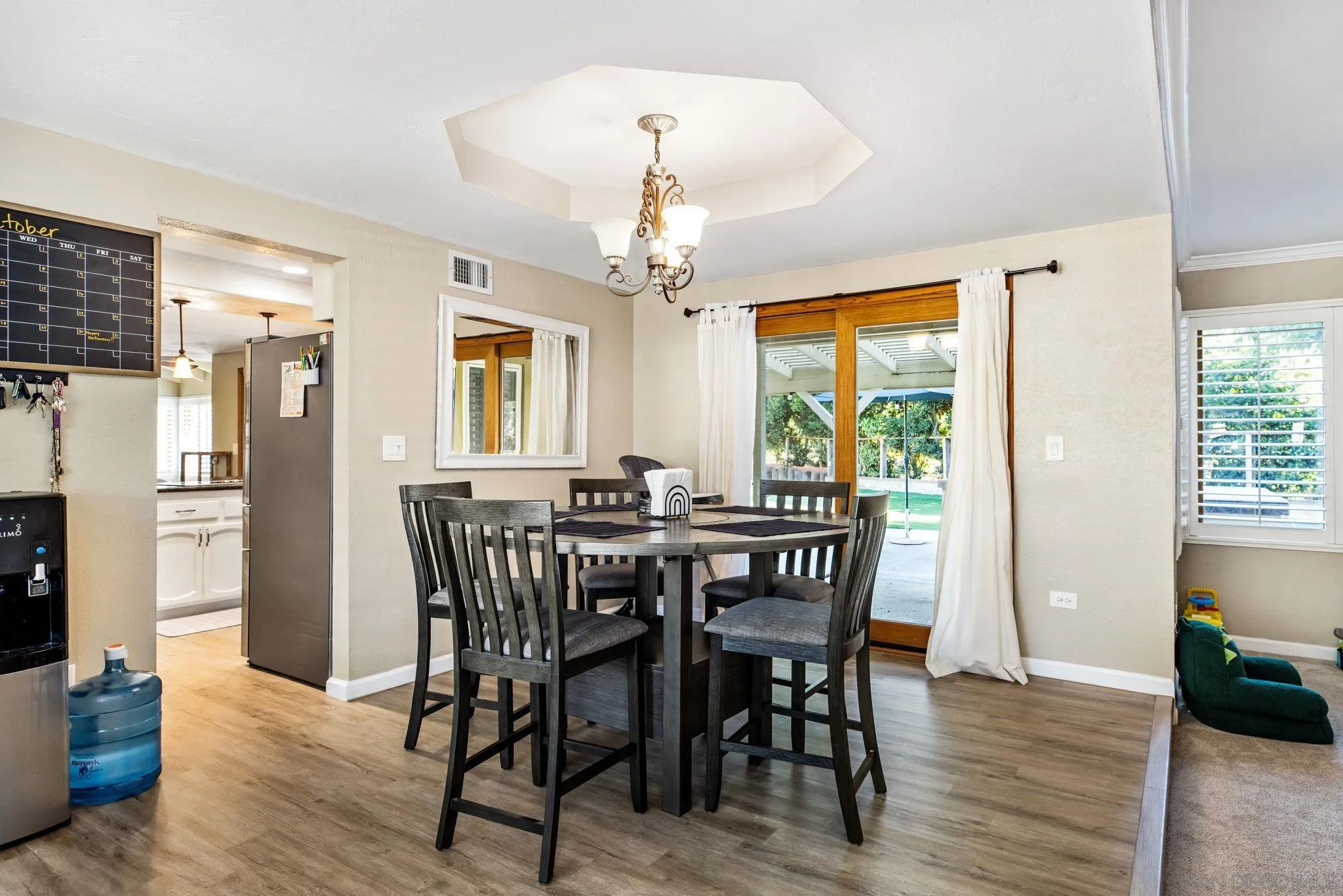 16614 Wikiup Road Ramona, CA 92065 - Photo 7 of 37 a view of a dining room with furniture window and wooden floor