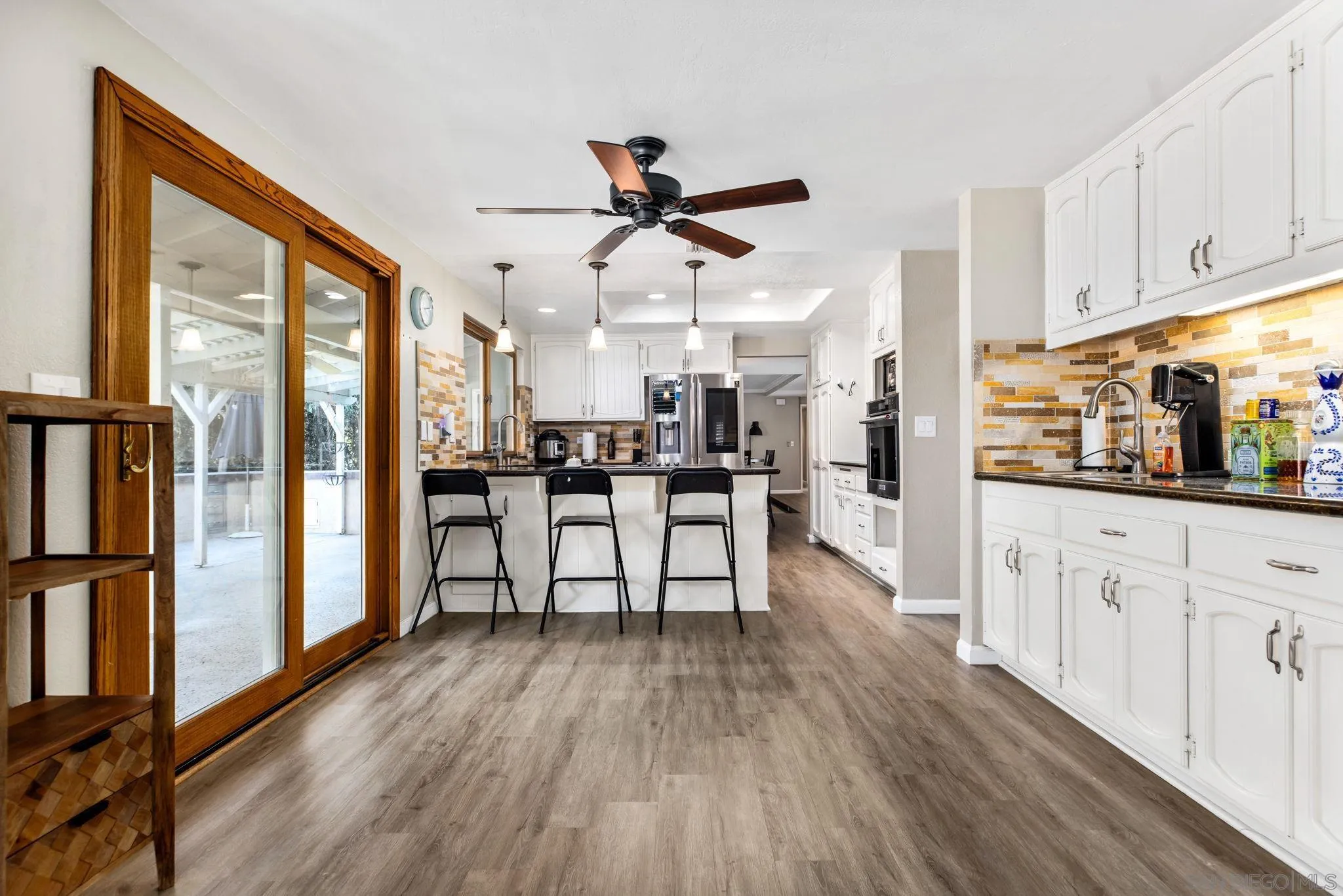 16614 Wikiup Road Ramona, CA 92065 - Photo 8 of 37 a view of a kitchen with wooden floor and a window