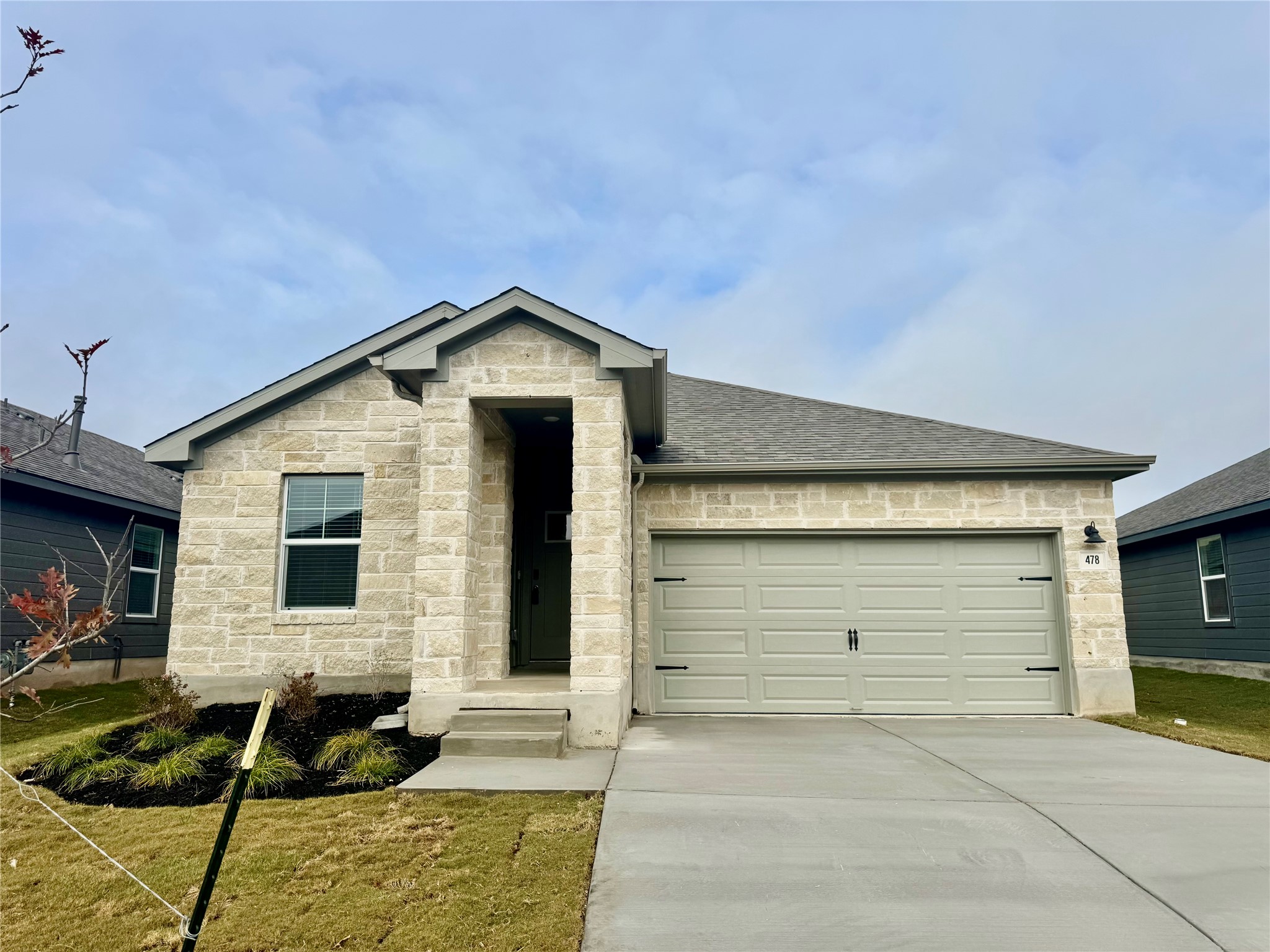 a front view of a house with a garage