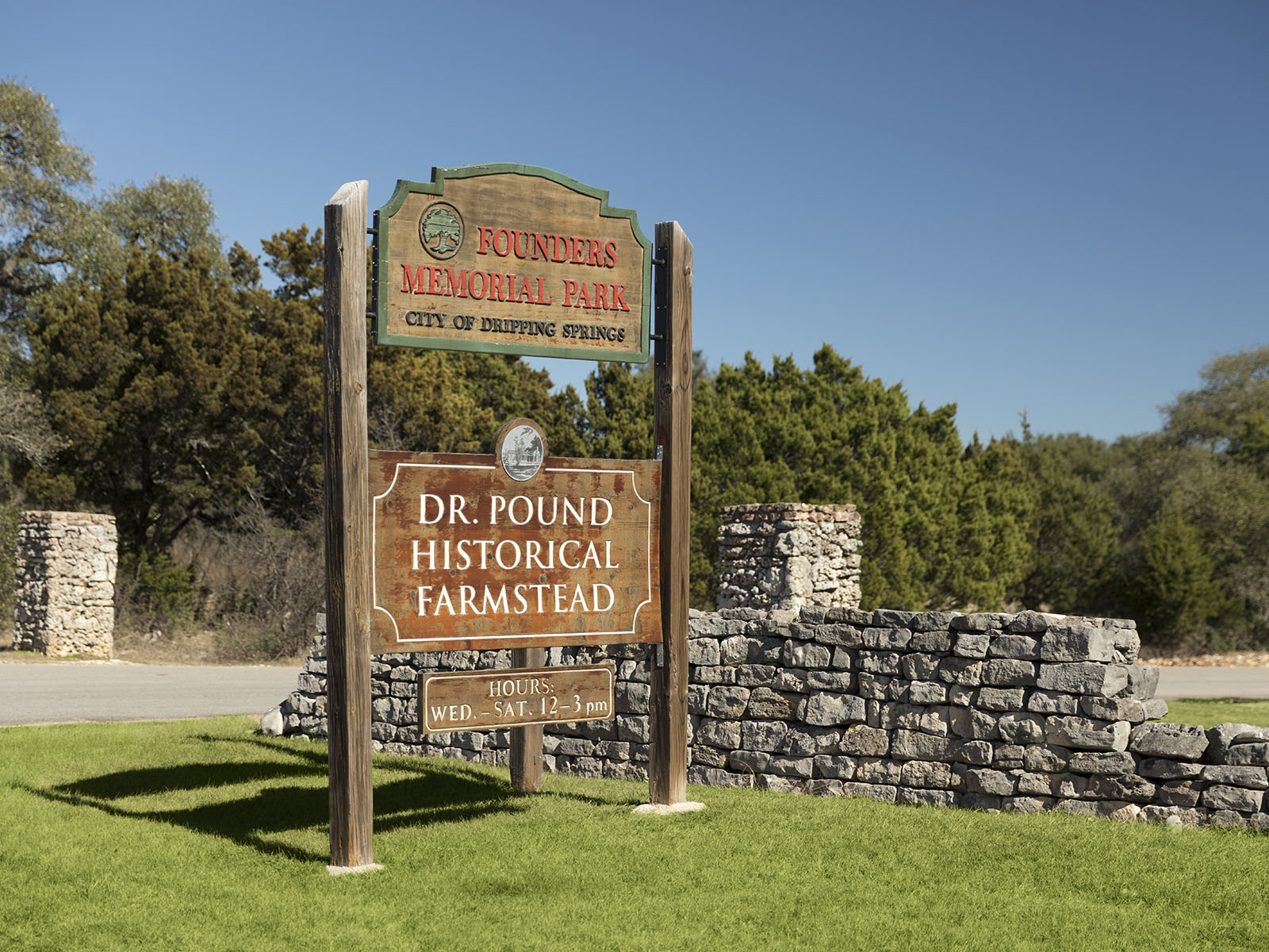 478 El Capitan Loop Dripping Springs, TX 78620 - Photo 9 of 14 a view of a sign board with a big yard