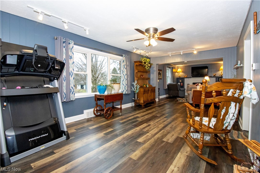 4464 Buss Road Wooster, OH 44691 - Photo 9 of 20 Dining space featuring dark hardwood / wood-style flooring, track lighting, and ceiling fan