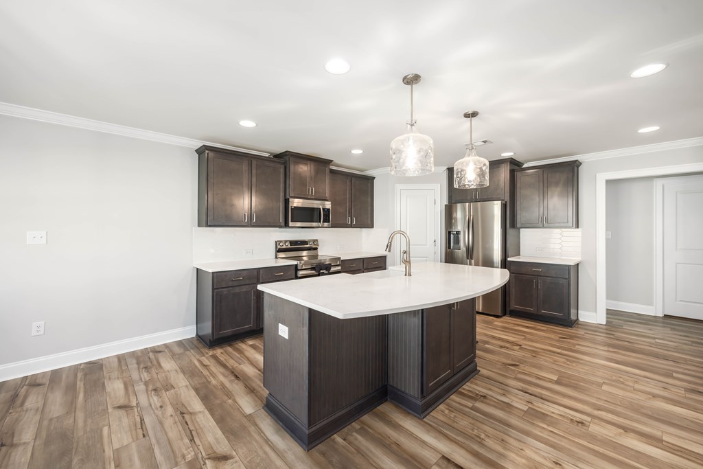 50 Ivy Loop Phenix City, AL 36867 - Photo 8 of 23 a kitchen with a sink a counter top space stainless steel appliances and cabinets