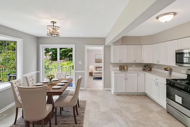 a view of a dining room with furniture window and outside view