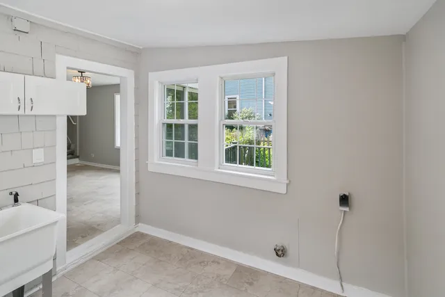 a view of an empty room with a window