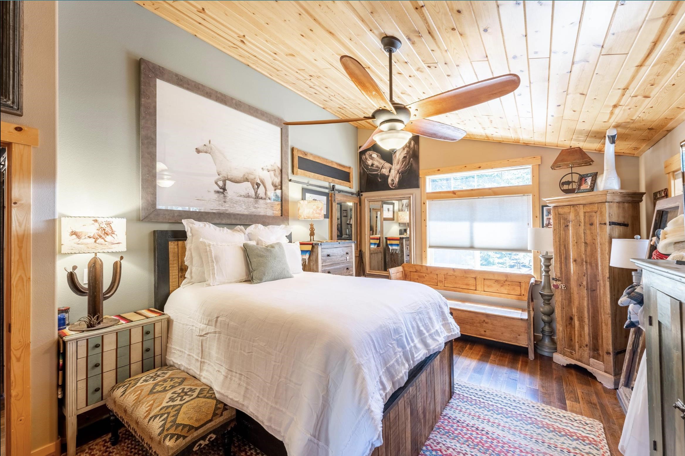 14175 Pathway Avenue Truckee, CA 96161 - Photo 7 of 21 a bedroom with a bed and wooden floor