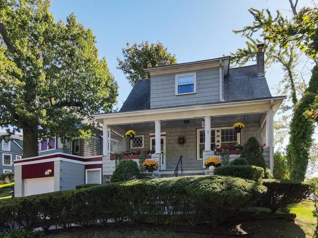 front view of a house with a garden