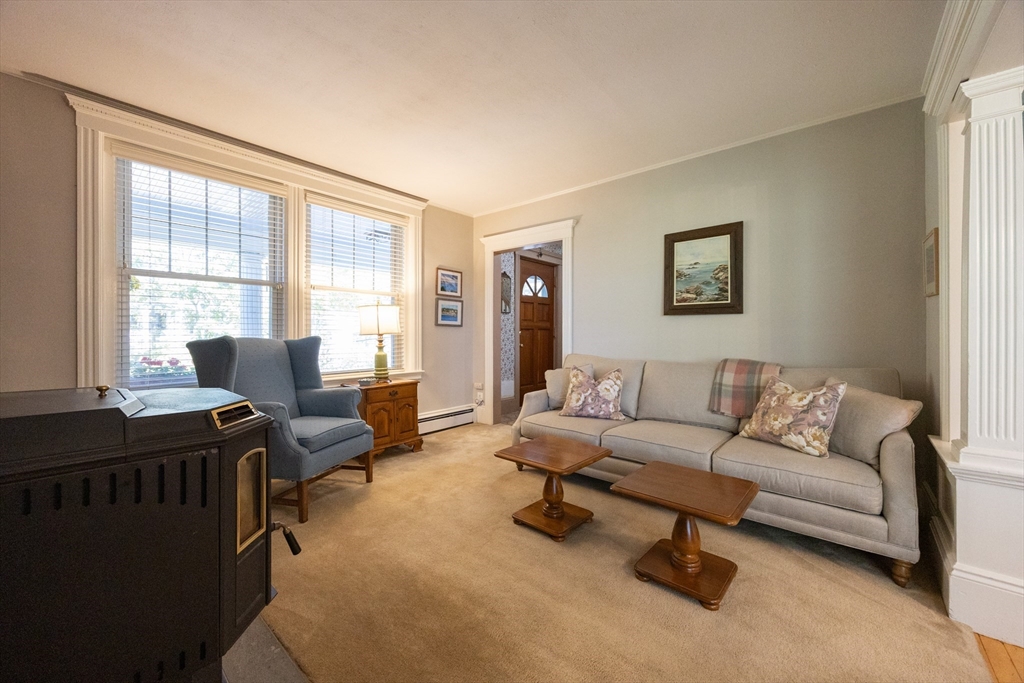 41 Roy Street Swampscott, MA 01907 - Photo 15 of 42 a living room with furniture and a window