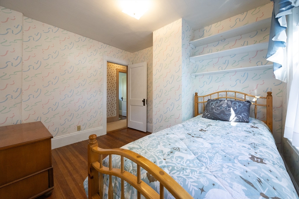 41 Roy Street Swampscott, MA 01907 - Photo 26 of 42 a bedroom with a bed and a window